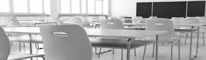 Wax training Classroom with chairs and desks and blackboard